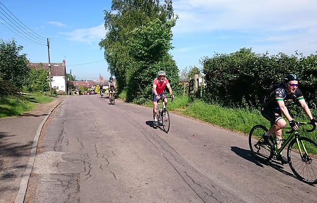 Three cyclists on club ride through Felmersham in Greast Ouse valley