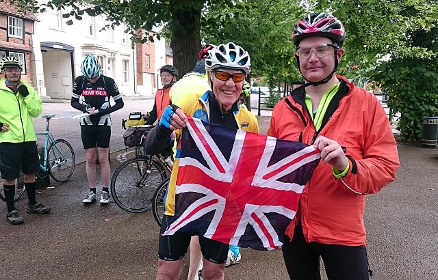 Cyclists from CTC Northampton and CTC Milton Keynes holding a Union Jackon at meetup in Buckingham - Guy Barber Memorial Ride 2017