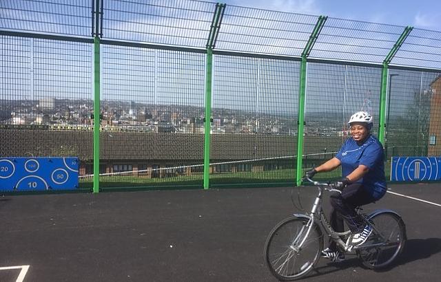 photo of woman cycling on a playground