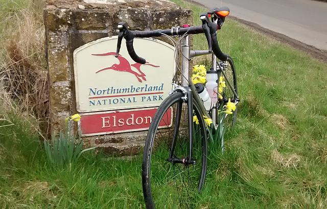 Bike next to Northumberland National Park sign