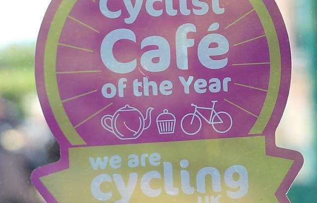 Cyclist Cafe of the Year Nominee 2020 sticker in window of Walled Garden Cafe.