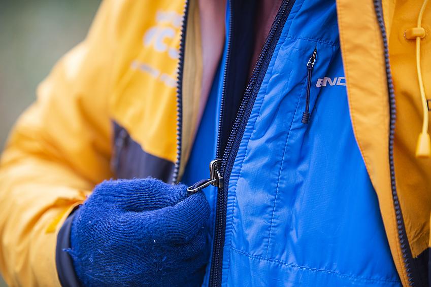A close-up showing a cyclist in warm winter clothing