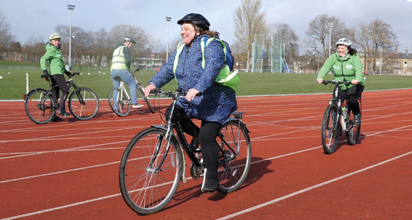 Two cyclists riding on a track
