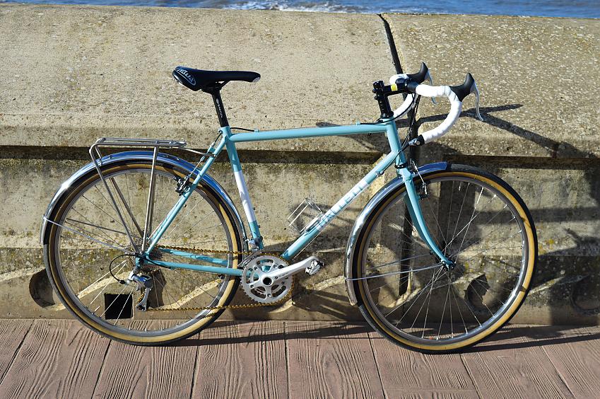 Hallett 650 Adventure, a sky blue bike leaning against a sea wall