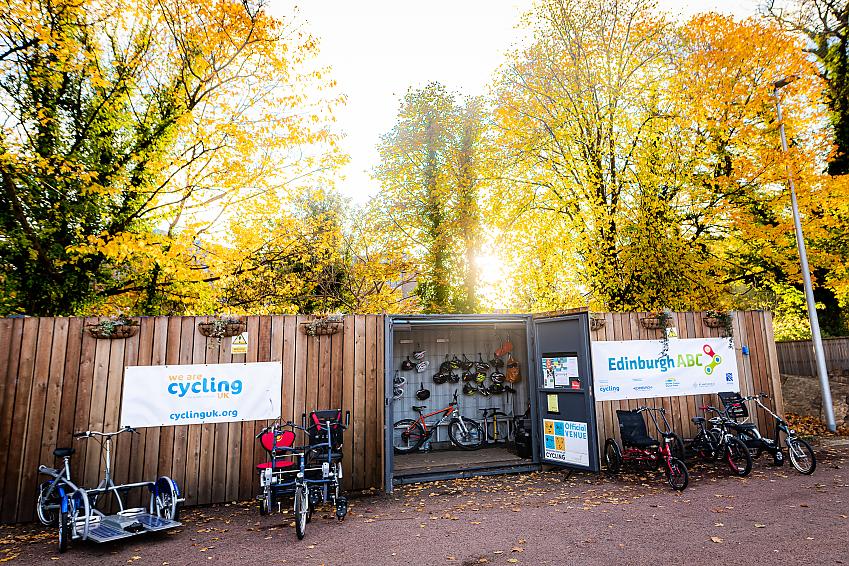 A range of adaptive bikes parked outside the Edinburgh ABC base in Saughton Park