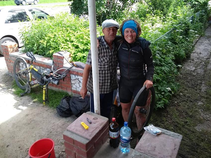 Jenny Graham with a friendly man she met while fixing a puncture in eastern Russia