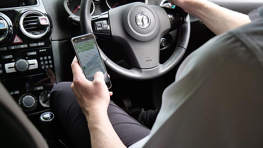 Person using their phone while driving