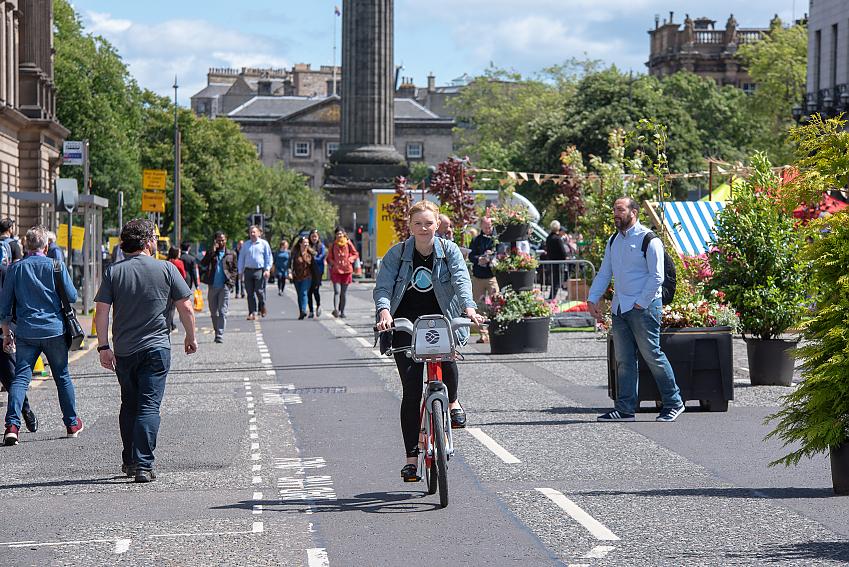 Woman cycling in Edinburgh, Scotland