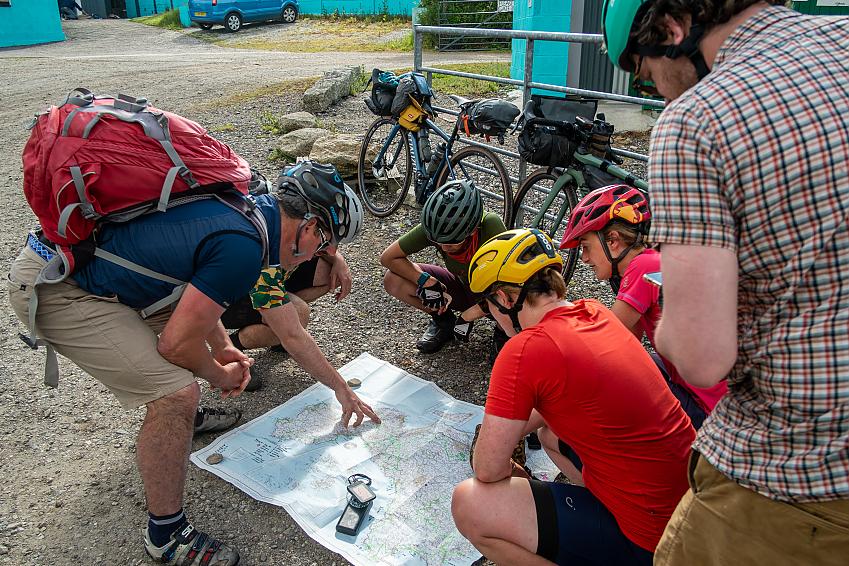 Cyclists looking at a map