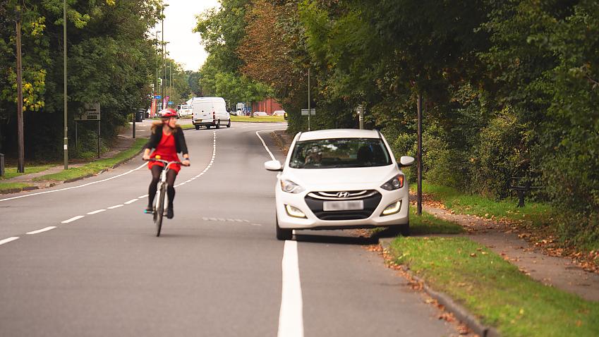 Cyclist swerves to avoid car parked in cycle lane