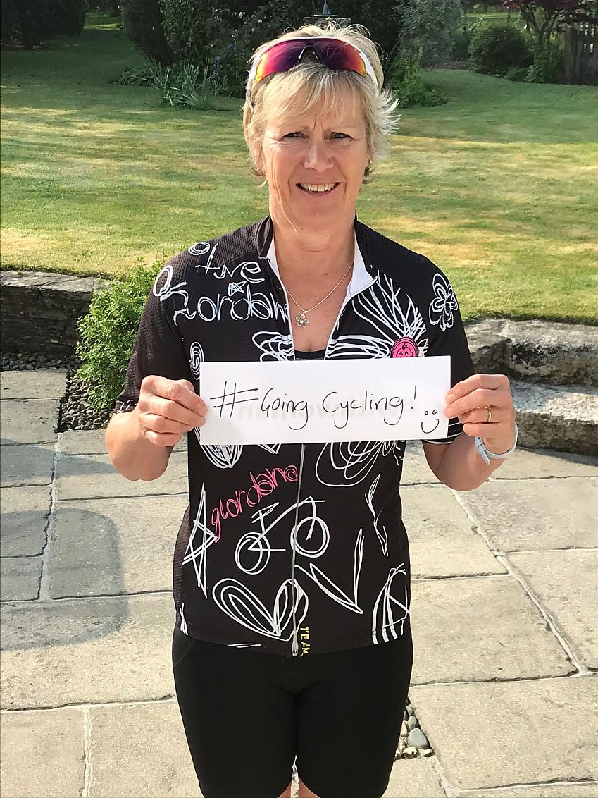 Judy Baker holding #GoingCycling sign