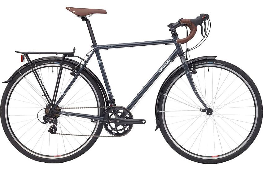 The Adventure Flat White, an adventure bike with rear rack and drop handlebar. It's black with logos in white