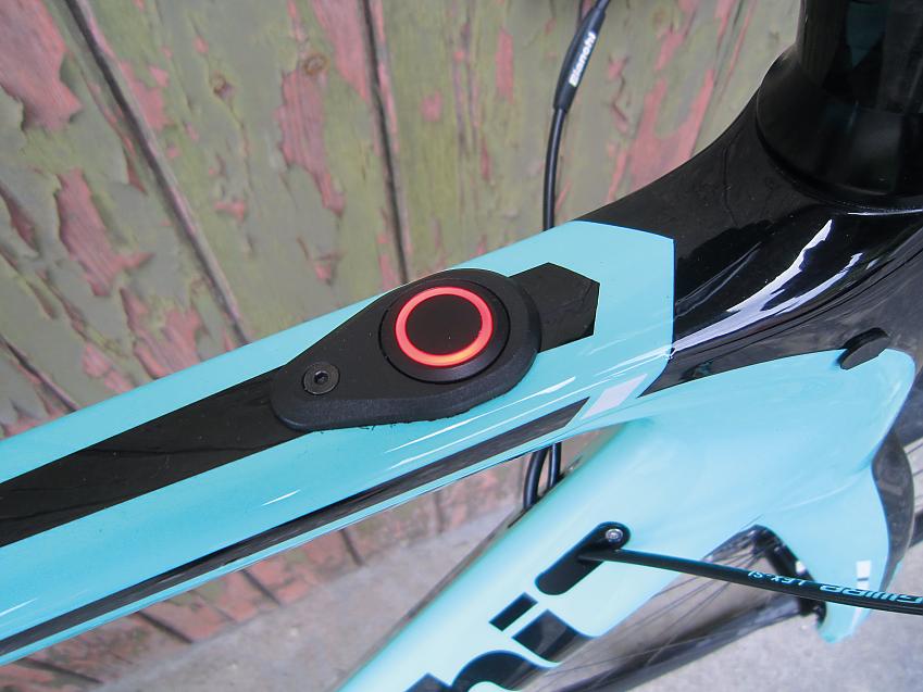 A close-up of the Bianchi's top tube showing the on-off button