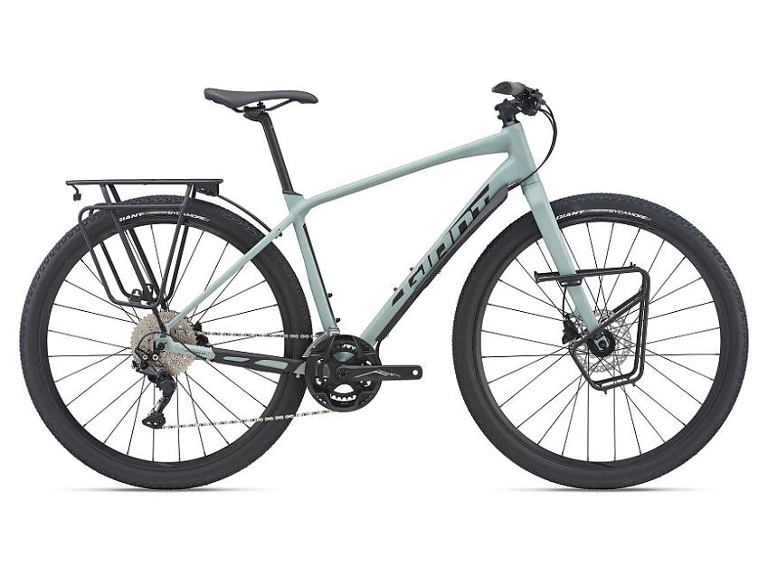 Giant Toughroad SLR 1, a pale blue-grey touring bike with flat handlebar and rear and front racks