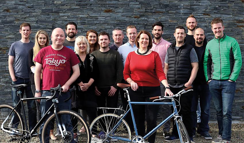 Founders Phillip and Irene McAleese (with bikes) with the See.Sense team.