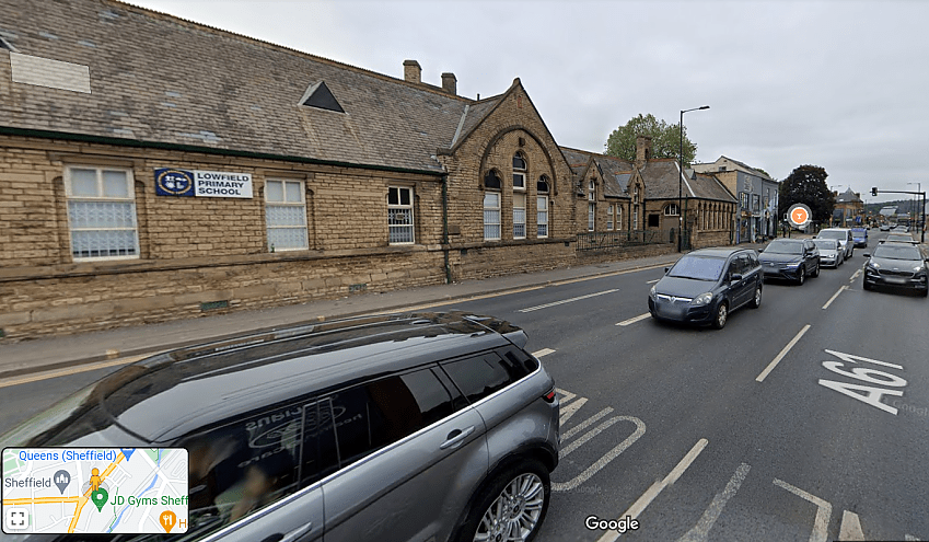 A Google Maps street view image of Lowfield Primary School, Sheffield, aside the A61. Many motor veichles are passing in close proximity to the school. 