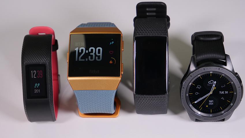 A selection of fitness trackers including fitbits