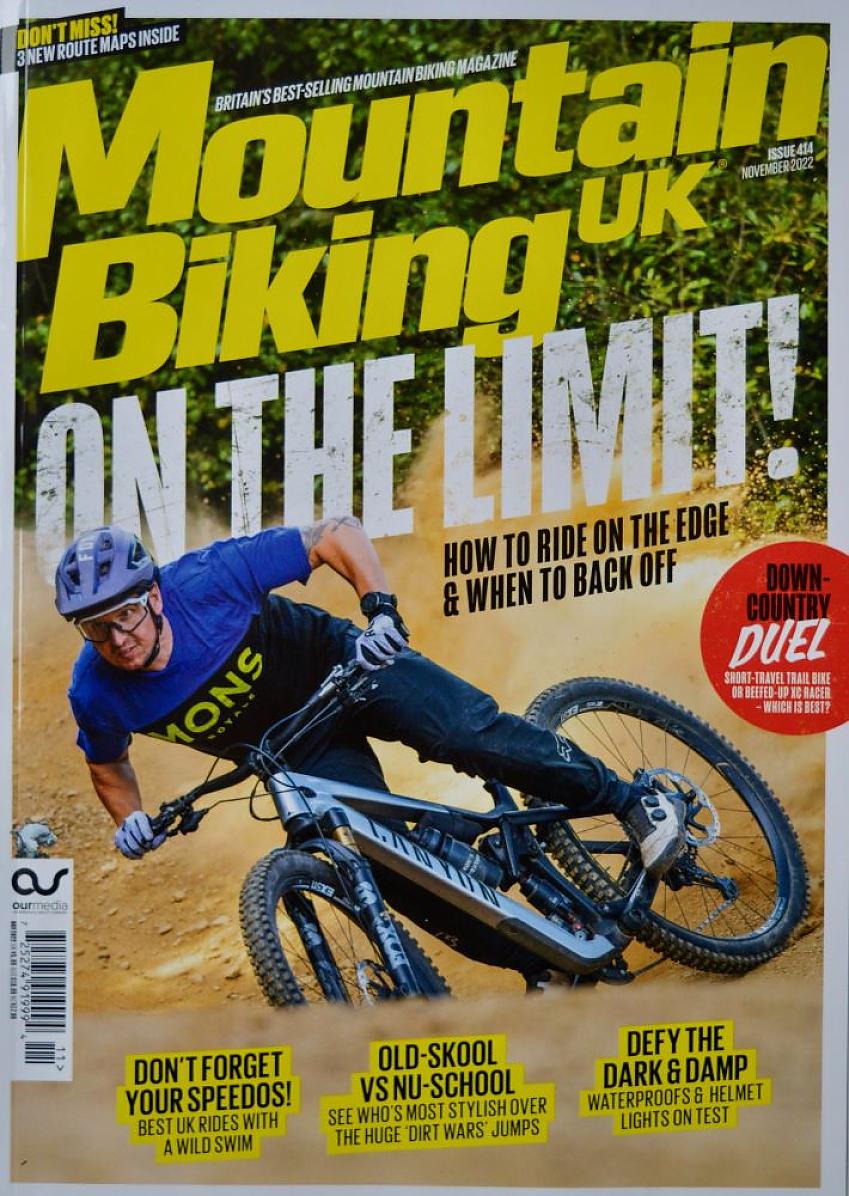 Mountain Biking UK cover, November 22 issue, showing a man on a silver Canyon mountain bike riding downhill on gravel