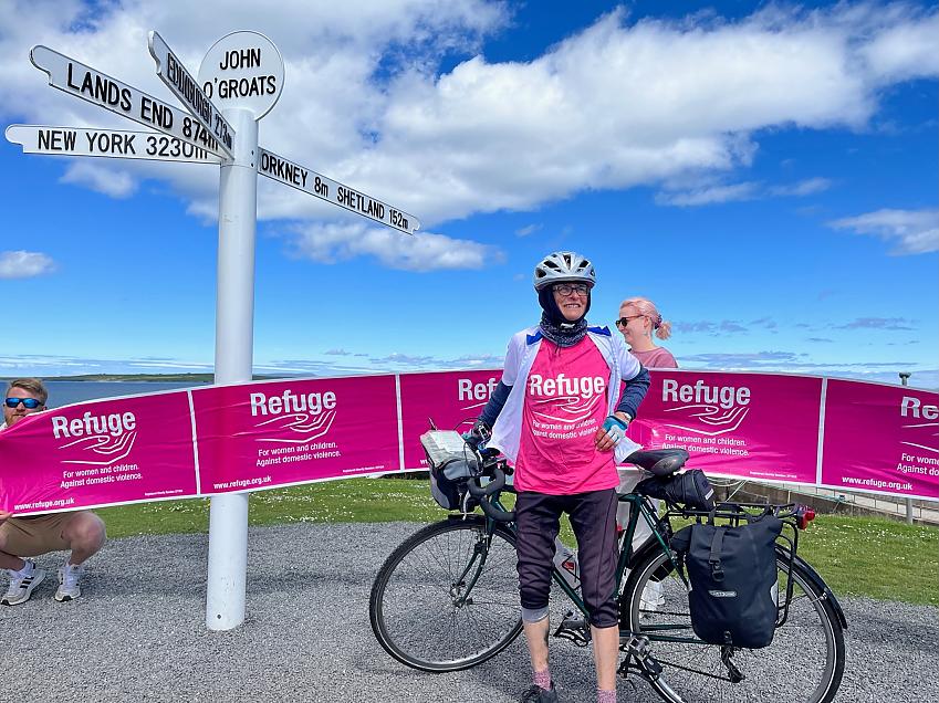 Gina Harris poses with her bike at John o'Groats