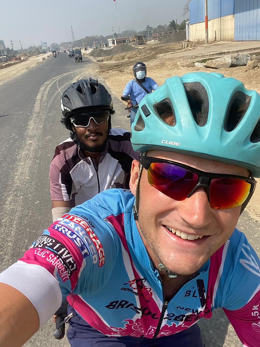 Cyclist Luke Grenfell-Shaw takes a selfie of himself and fellow rider Tanvir riding Luke’s tandem in Dhaka
