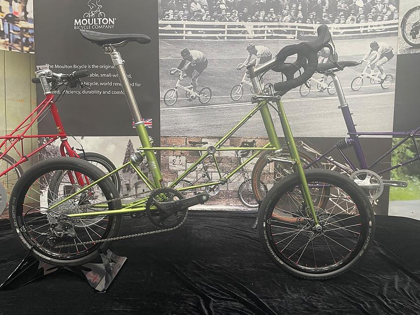 Moulton at Bespoked. Close-up of a green Moulton bike with small wheels