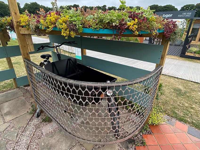 Could Car Less garden showing the cycle shelter with a cargo bike; photo by Julie Skelton