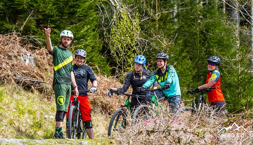 A group of mountain bikers on the trails of Coed y Brenin trail centre in Wales