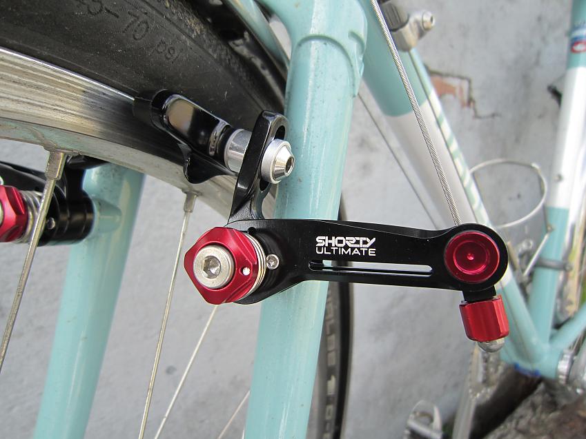 A close-up showing a bike’s brake pad and mechanism
