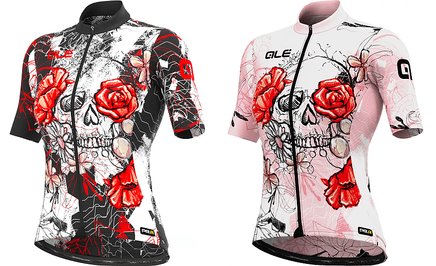 Two short-sleeved cycling jerseys, one with a black background, one with pink. They have the same design of white skulls and red roses