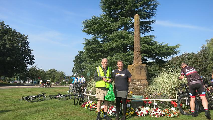 John Sullivan and Christina Bengston standing in front of the monument commemorating Meriden as the traditional centre of England