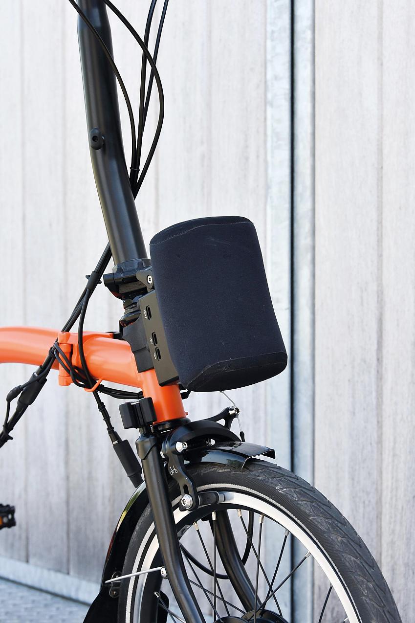 Arcc Innovations Brompton with E2-pod conversion kit; it shows the battery pack mounted to the front of a Brompton
