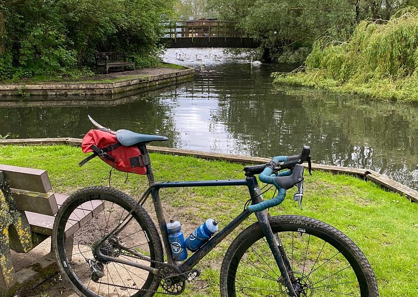 Bike in front of bridge over water