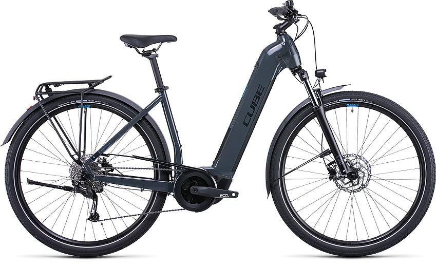 An electric step-through bicycle with mounted rear racks and mudguards. The bike is a dark grey/blue colour