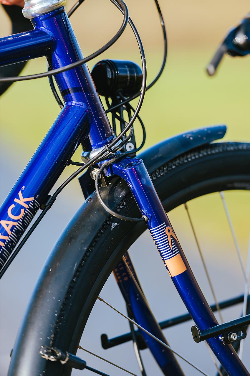 A close-up of the Bombtrack Arise Tour's head tube and fork showing the cabling going into the fork