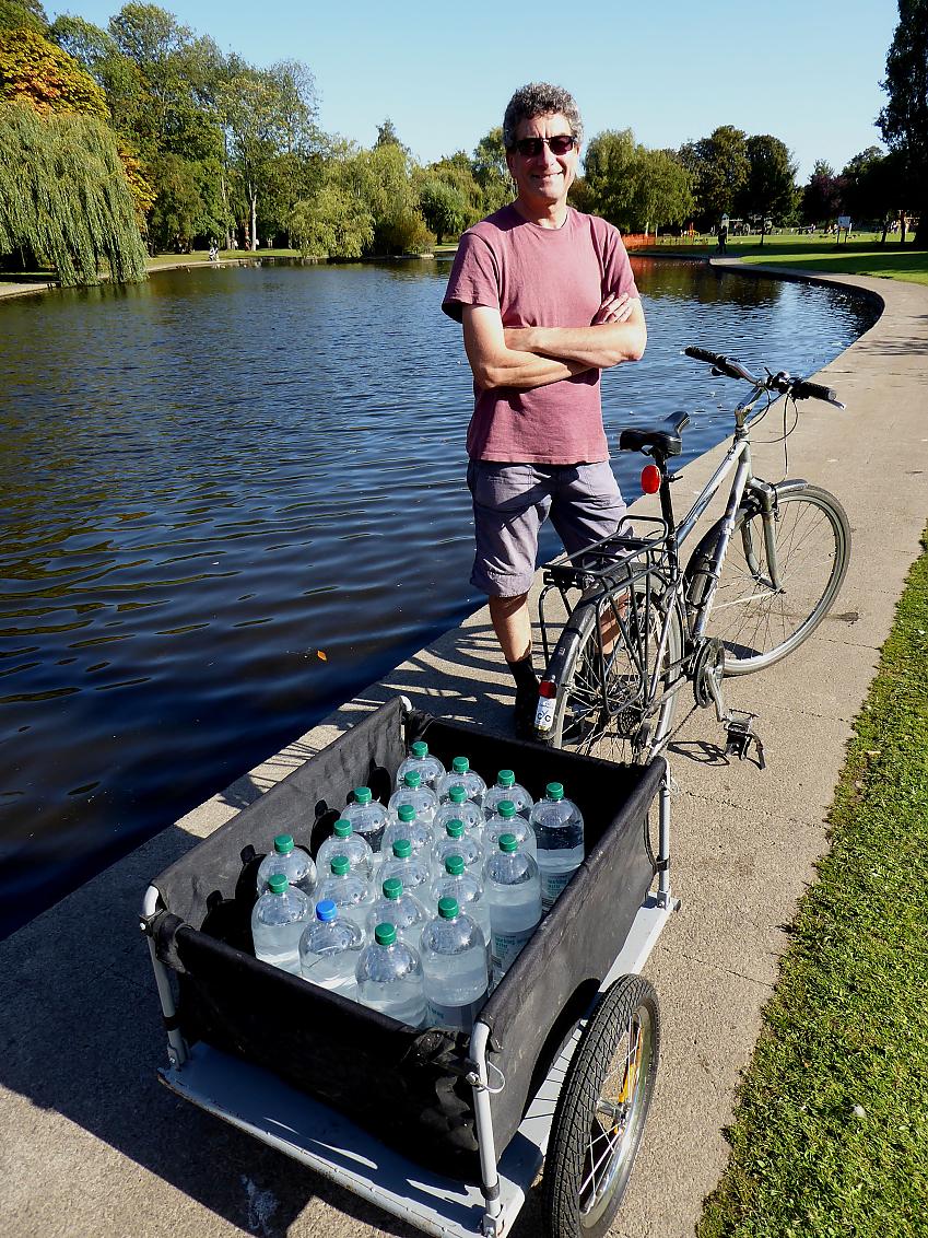 Rob Ainsley with a trailer full of water bottles