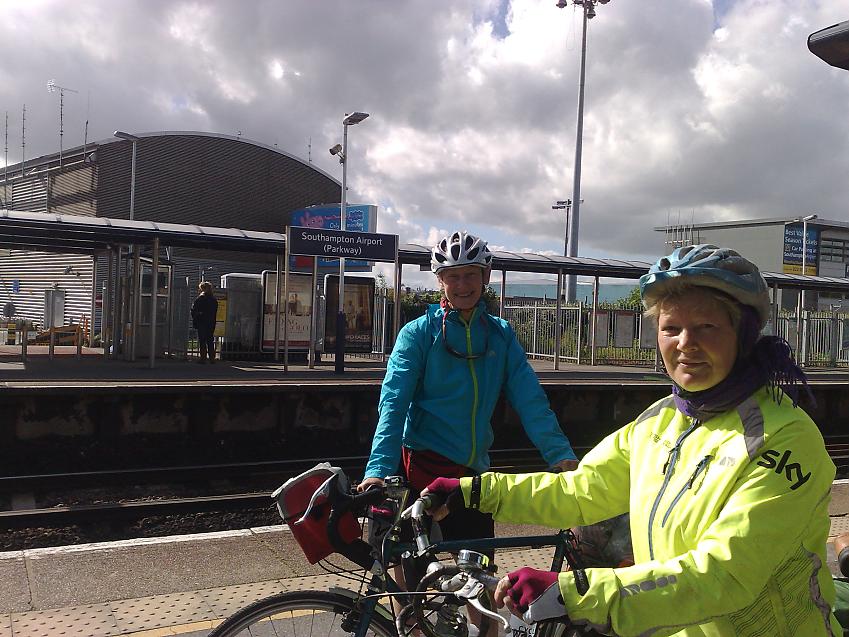 Two women with bicycles at Southampton Airport train station