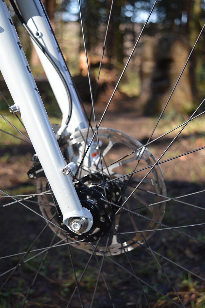 A close-up of the Krampus's front fork, hub and disc brake