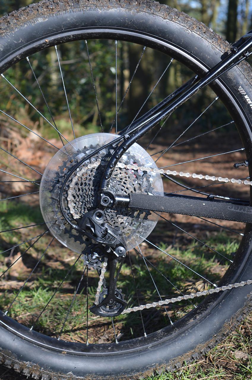 A close-up of the Jones's seatstay showing the various points for mounting a rear rack. Also seen are the cassette, rear derailleur and chainstay