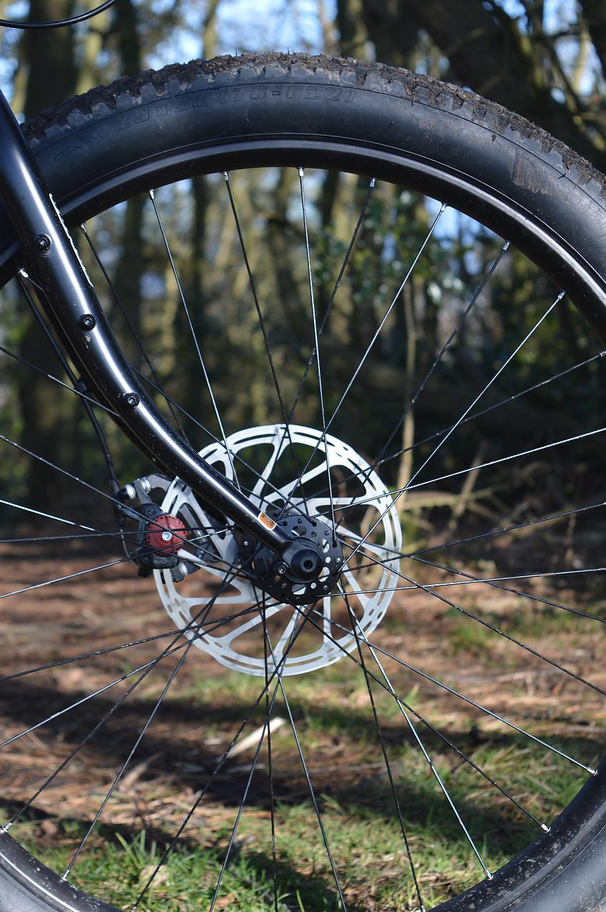 A close-up of the Jones's front fork, hub and disc brakes