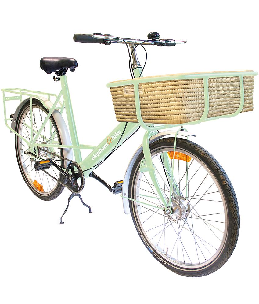 Elephant Bike, a pale green urban bike with a rear rack and big frame on the front for holding a basket. This one has a wicker basket. 
