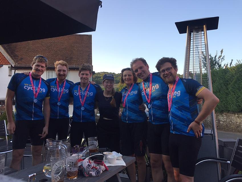 Team Cycling UK with beer and medals at the end of the Tour of the Hills