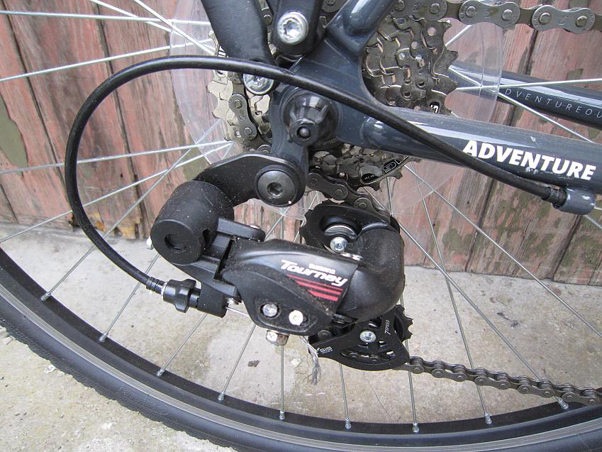 A close-up of the Adventure Flat White's cassette and rear derailleur