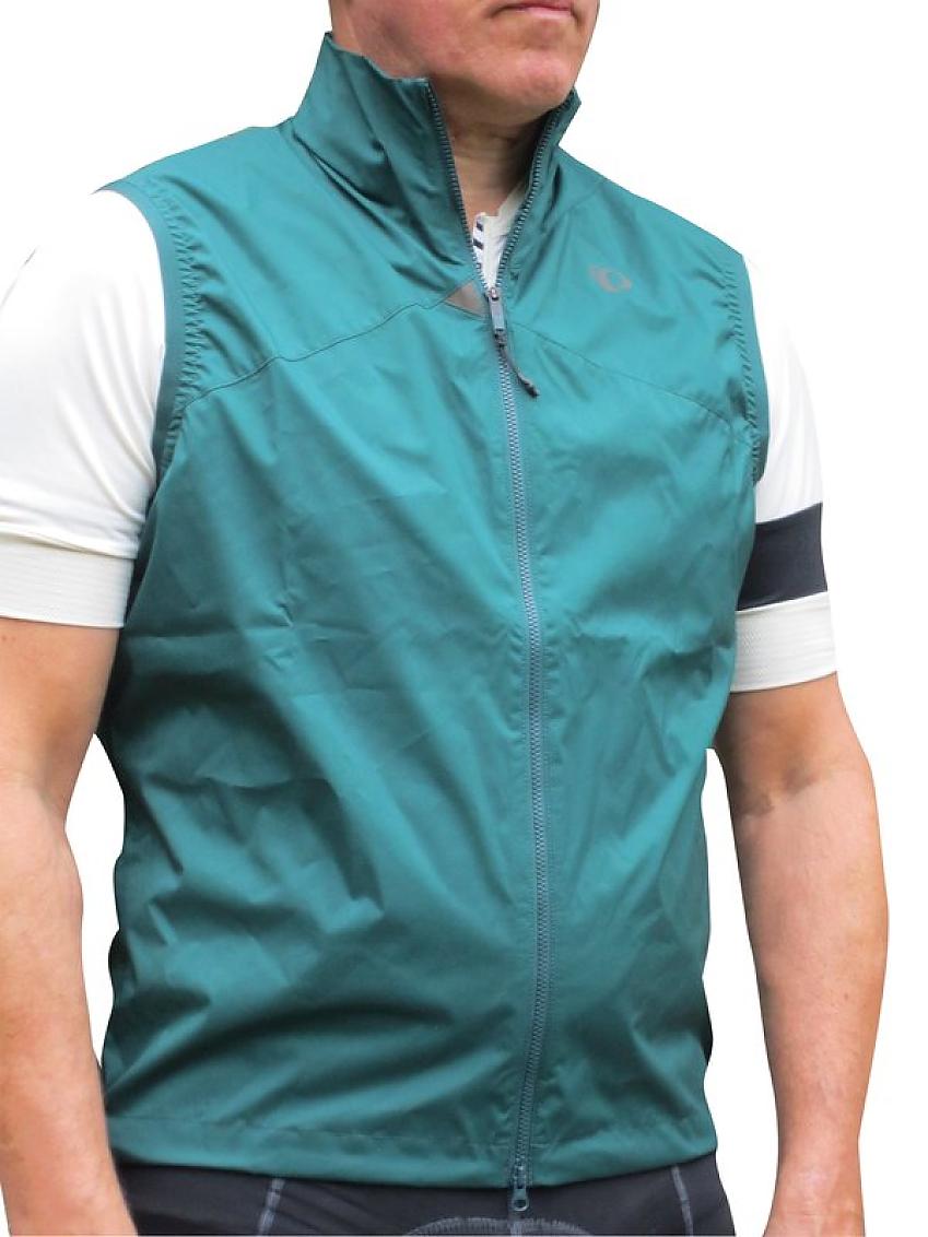 A lightweight gilet in turquoise, modelled by a man