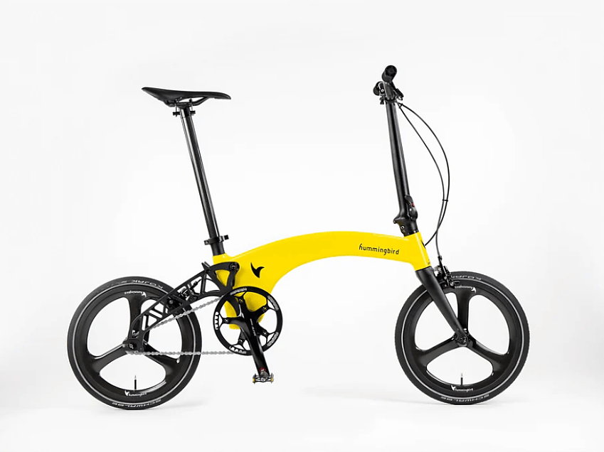A bright yellow folding bicycle