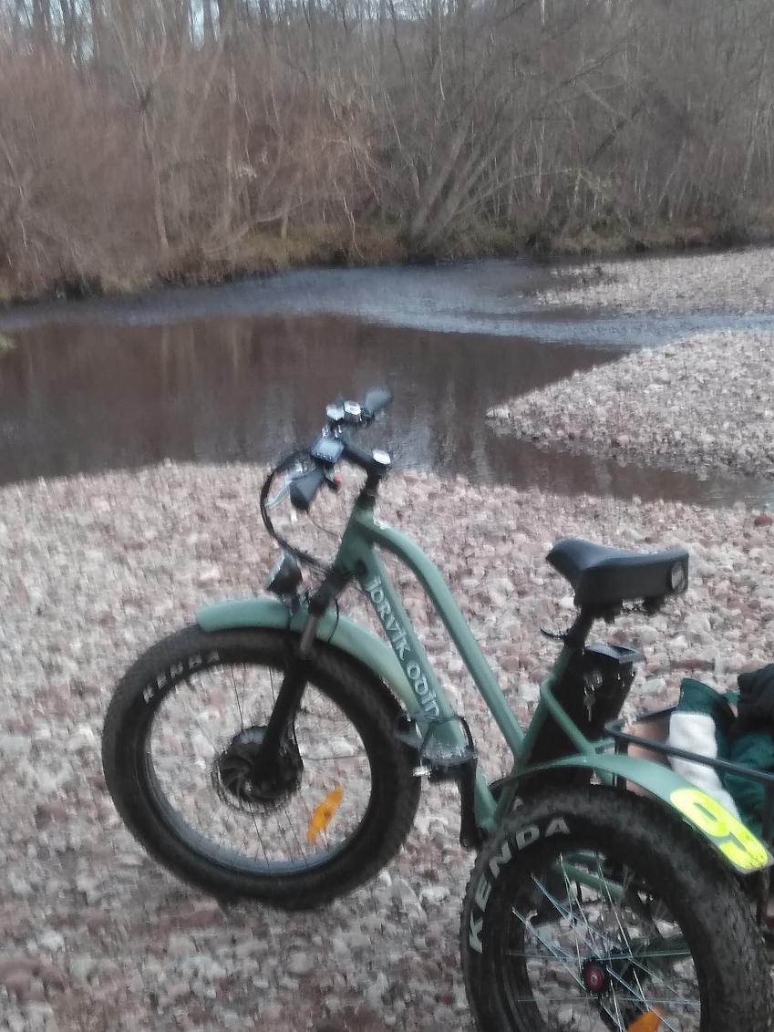 A trike at the shore of the river