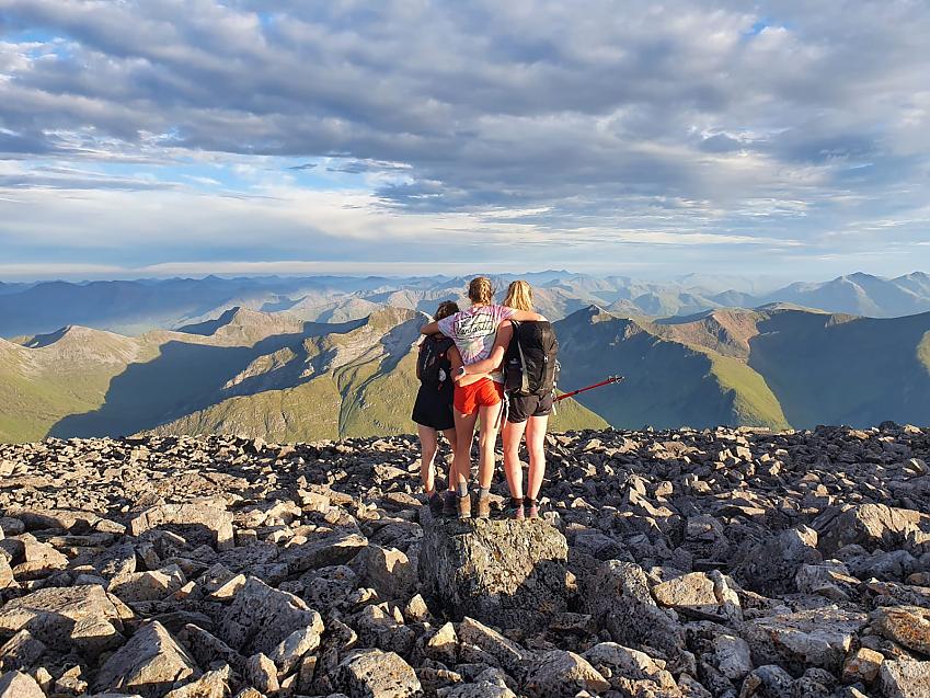 Emily, Saoirse and Cass high up on Ben Nevis, taking in the views of the Scottish Highlands as the sun is beginning to go down
