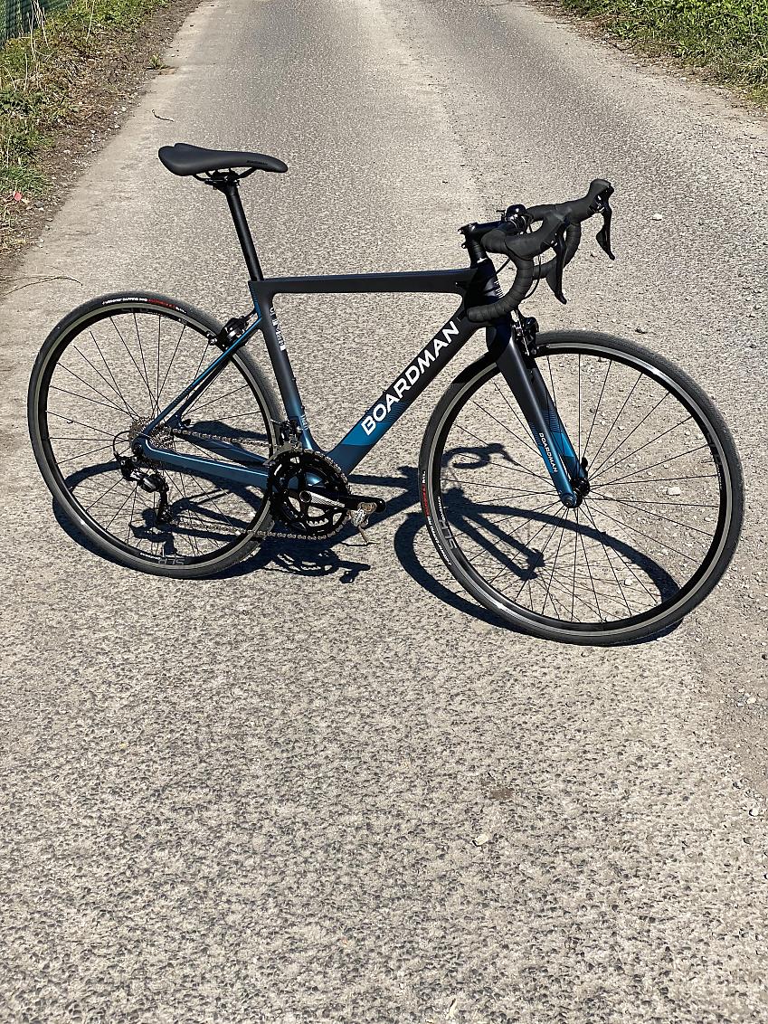 Boardman SLR 8.9 Carbon Women’s, a blue and black road bike propped up in the road