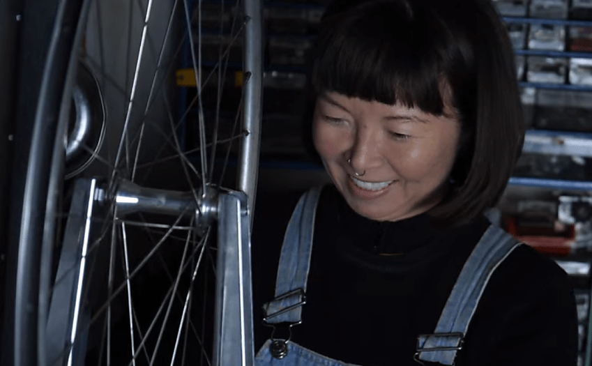 Jenni Gwiazdowski of London Bike Kitchen fixing a wheel