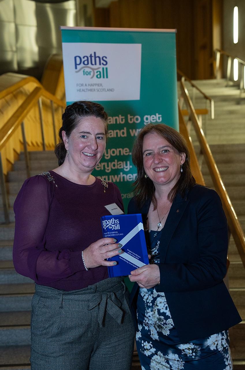 Jenni Murray receiving her award at the Scottish Parliament
