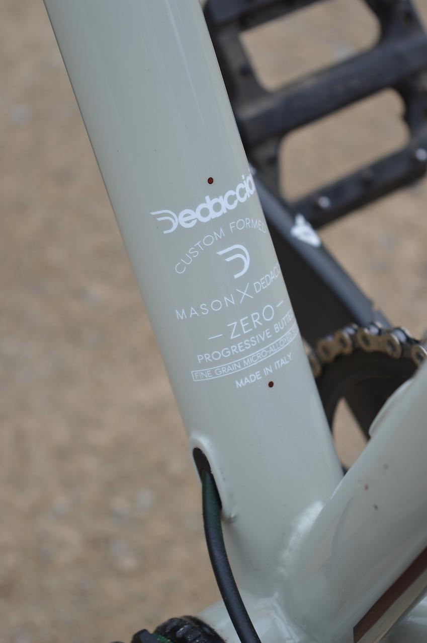 A close-up of the Mason's down tube at the bottom where it meets the seat tube. You can see the logo and where the cables go into the frame